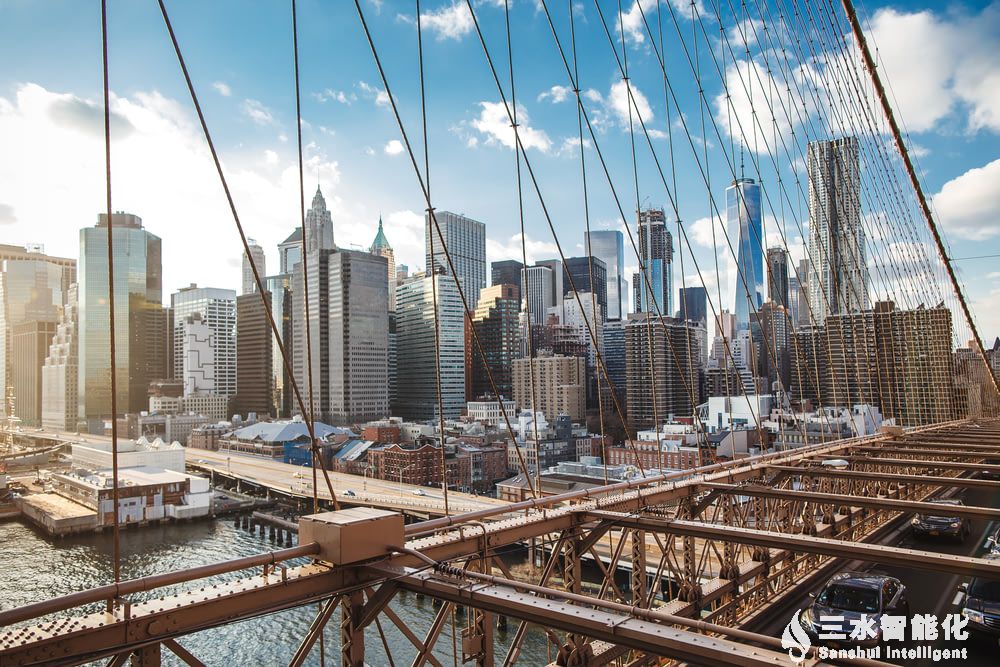 brown metal bridge over the city during daytime.jpg